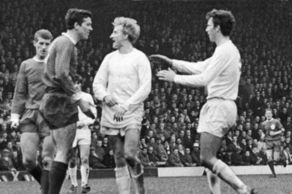 United's Denis Law has a word with Ron Yeats of Liverpool in a goalless draw at Anfield in 1967